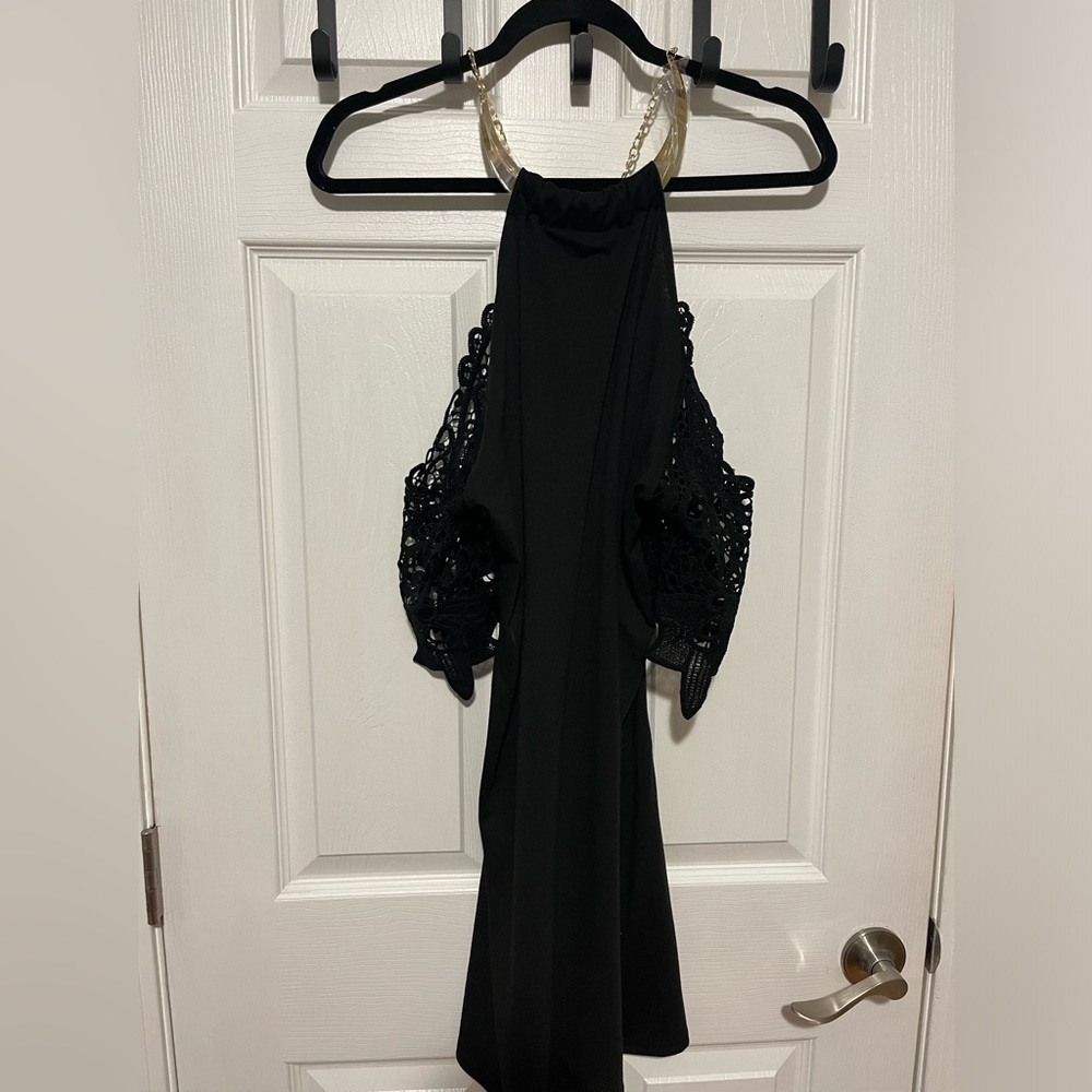 Black off the shoulder mini dress with built in gold necklace.